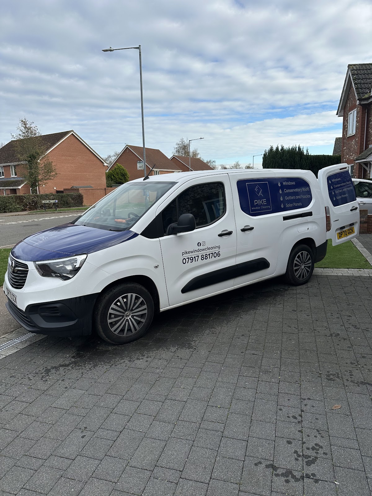 White Pike Window Cleaning van on location